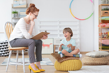 pediatrician talking to young boy