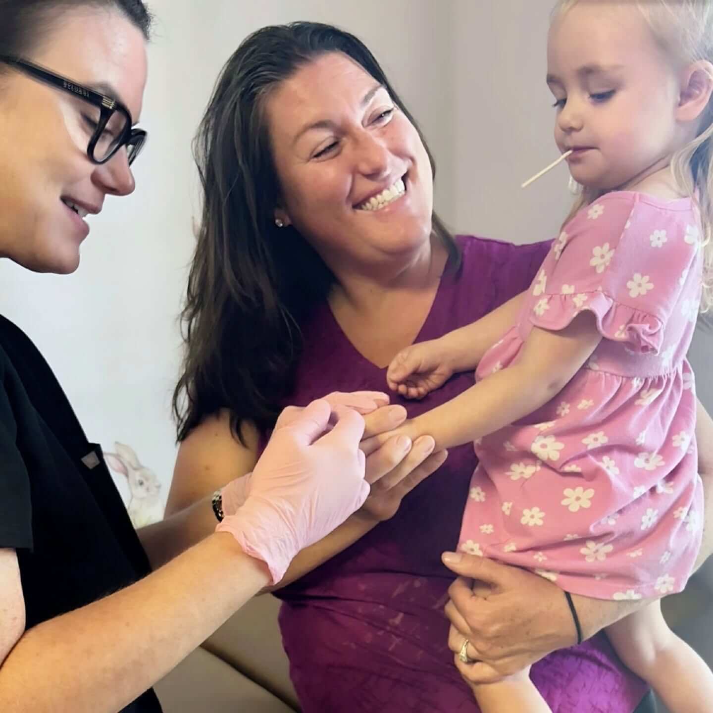pediatrician treating young boy