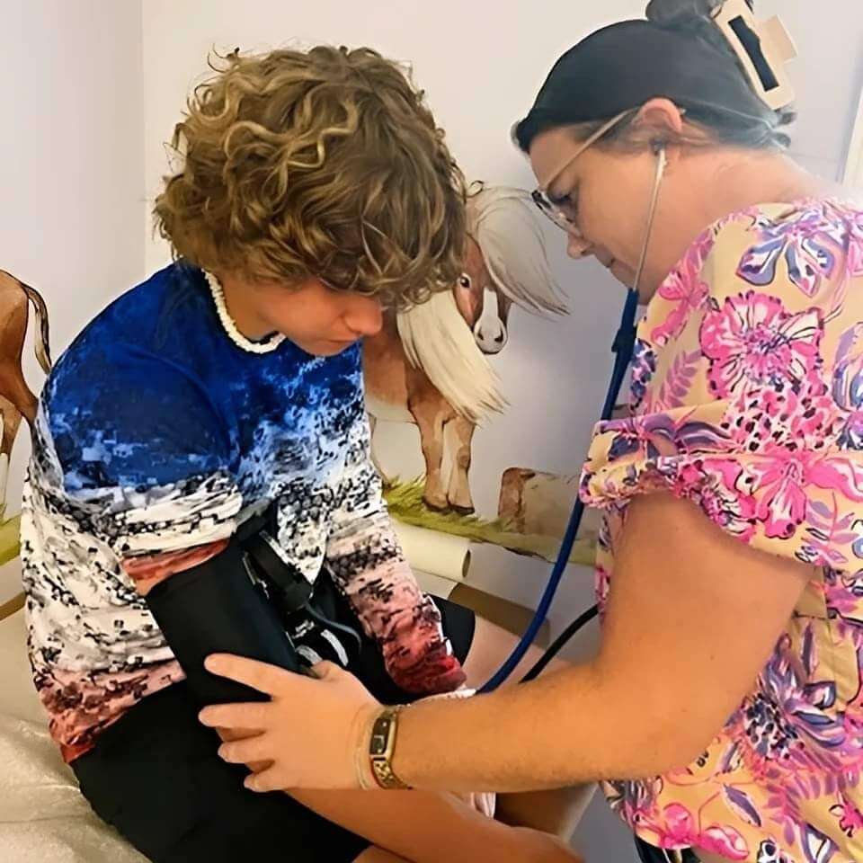 pediatrician talking to young boy